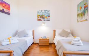 A bed or beds in a room at Villa Luritu Luxury Pool Tricase by HDSalento