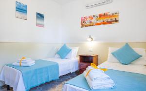A bed or beds in a room at Villa Luritu Luxury Pool Tricase by HDSalento