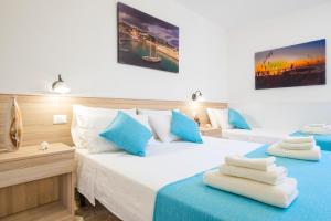 A bed or beds in a room at Villa Luritu Luxury Pool Tricase by HDSalento