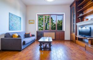 A television and/or entertainment centre at Villa Luritu Luxury Pool Tricase by HDSalento