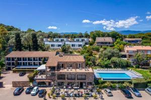 an aerial view of a resort with a pool at Hotel Shegara in Porto-Vecchio