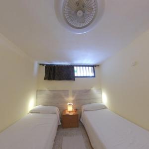 Postel nebo postele na pokoji v ubytování Apartamentos Santabarbara