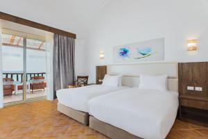 Pickalbatros Villaggio Aqua Park - Portofino Marsa Alam客房内的一张或多张床位