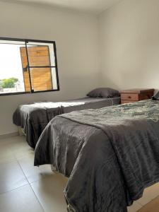 Кровать или кровати в номере La Porteña