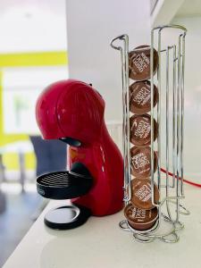 a red hair dryer next to a group of chocolateuts at Barnstaple Drive House in Manchester