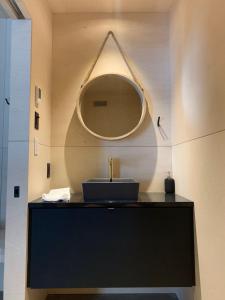 a bathroom with a sink and a mirror at Cabine A in Petite-Rivière-Saint-François +45 photos