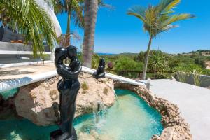 a statue of a girl in a fountain at Villa Heaven in Protaras