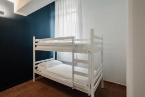 Postel nebo postele na pokoji v ubytování OSTELLO HENRY