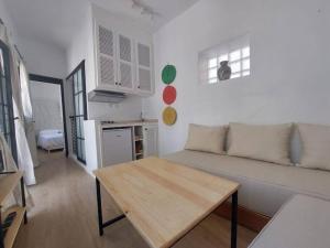 a living room with a couch and a table at Dar Zwina, Charming and lovely house in Tangier