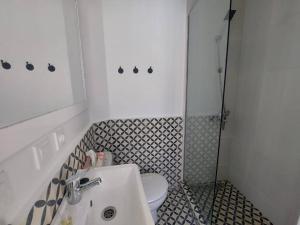 a bathroom with a toilet and a sink at Dar Zwina, Charming and lovely house in Tangier
