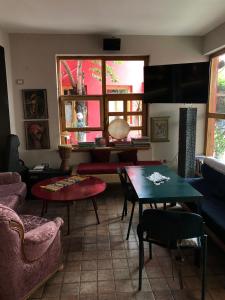 a living room with a couch and a table at Red Goat Hostel in Tirana