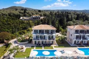 an aerial view of a villa with a swimming pool at Gkountis Apartments in Tsoukaladhes