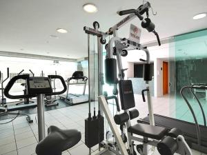 a gym with cardio equipment in a room at Flat Hotel Mercure - Centro de Brasília A012 in Brasilia