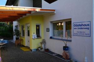 a building with a sign on the side of it at Gästehaus am Lindenweg in Meersburg