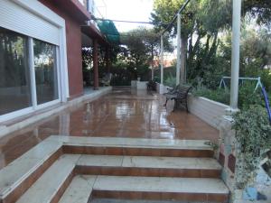 a patio with a bench on a house at Chalet La Serreta in Alicante