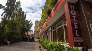 a building with a sign on the side of a street at Hotel Windsor-Mombasa in Mombasa +37 photos
