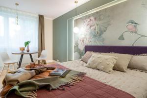 Posteľ alebo postele v izbe v ubytovaní Apartamenty Stara Warszawska 43