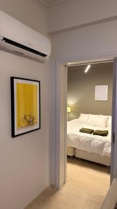 a bedroom with a bed and a bike on the wall at The NOTARY - Athens in Athens