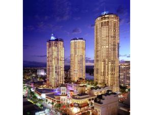 a group of tall buildings in a city at night at Chevron Renaissance 2 Bed Apartment by Vaun in Gold Coast