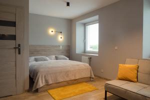 Katil atau katil-katil dalam bilik di Hotel Pod Brzozą