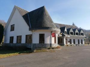 a large white building with a pointed roof at Hello Astur Green in Bimenes