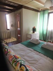 Postel nebo postele na pokoji v ubytování Locanda Corte Dè Guasconi