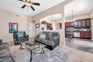 a living room with a couch and a table at Comfy Classy Home, Close To Everything in El Paso