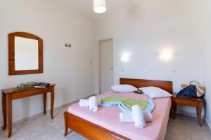 Postel nebo postele na pokoji v ubytování Nikiana Club - Studio 4 + 15 fotografií
