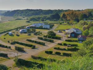 an aerial view of a farm with a bunch of crops at Camping Village Nature D'O in Hillion