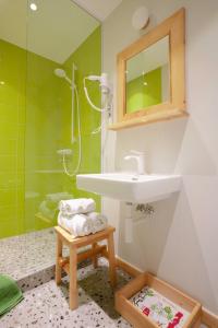 a bathroom with a sink and a shower at Gintarautojai in Palanga