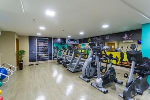 a gym with treadmills and ellipticals in a room at Flat Hotel Nobile A18 in Brasilia