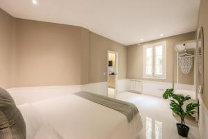 Łóżko lub łóżka w pokoju w obiekcie Apartamento Embajadores XV
