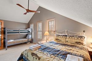 a bedroom with a bed and a bunk bed at Altitude Adjustment in Blowing Rock