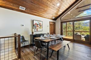 a dining room with a table and chairs at Angels Share in Seven Devils