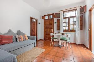 a living room with a couch and a table at Casa Hilaria in Garachico