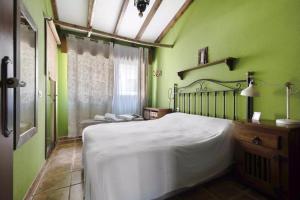 Łóżko lub łóżka w pokoju w obiekcie Casa Manus