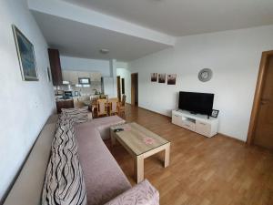 a living room with a couch and a table at Villa Domane Mario in Neum