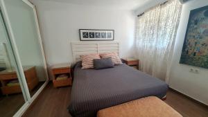 Łóżko lub łóżka w pokoju w obiekcie Coqueto piso con Billar en Benalmadena Costa