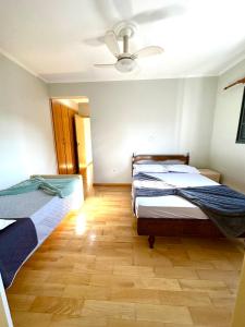 En eller flere senge i et værelse på Apartamento 32 no centro de Águas de São Pedro