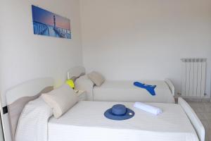 Posteľ alebo postele v izbe v ubytovaní Appartamento Nautilus 2 - MyHo Casa