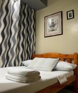 Postel nebo postele na pokoji v ubytování Antipolo Staycation & Transient Affordable Condo Unit By Myra