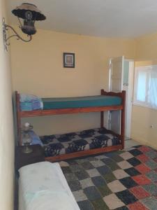 a bedroom with two bunk beds in a room at Flor de Lis room #1 in Mar del Plata