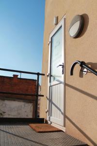 a door on the side of a building with a light at The Fountain Inn, Digbeth in Birmingham