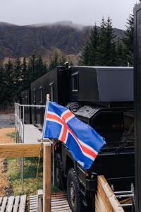 a british flag on the side of a truck at Golden Circle Truck Hotel in Selfoss