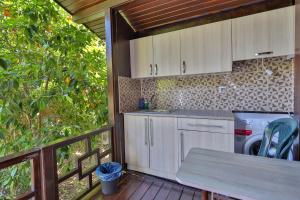 A kitchen or kitchenette at Cinderella Pension & Bungalow