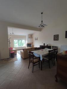 a living room with a table and chairs and a couch at EverGreen in Kavala