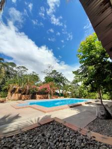 an image of a swimming pool at a resort at CHOCLINO ECOLODGE -Bungalows con Piscina privada, Mirador y Tours en la selva in Tarapoto