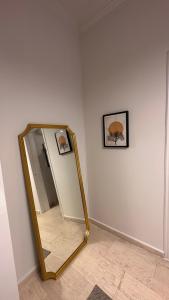 a mirror in a corner of a room at The NOTARY - Athens in Athens