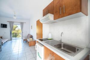 a kitchen with a sink and a counter top at Maria's Studios in Frangokastello