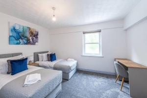 Ένα ή περισσότερα κρεβάτια σε δωμάτιο στο St Pauls Square Holiday Home - Preston